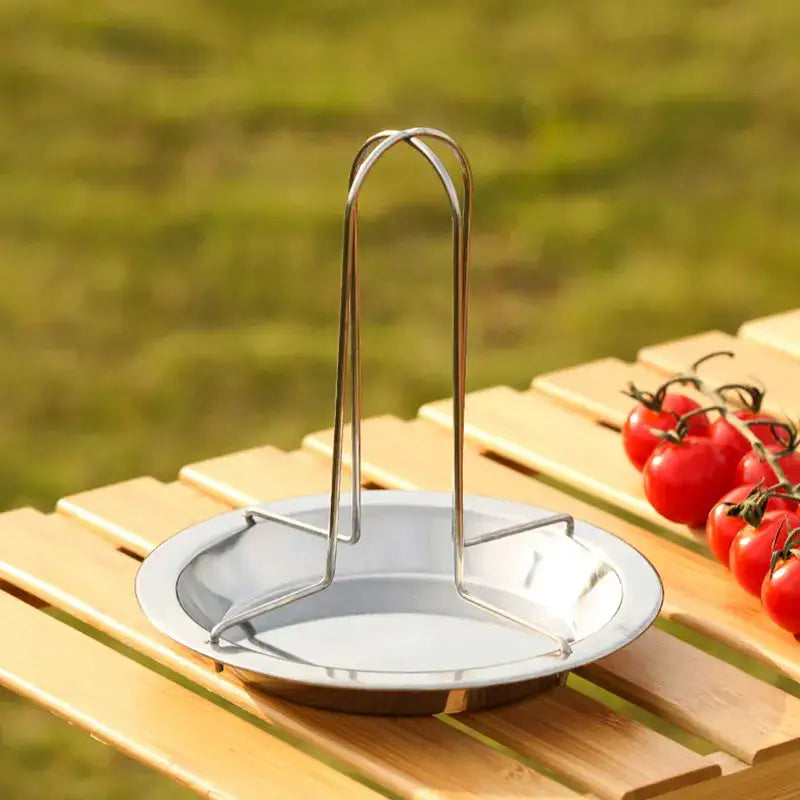 Shiny stainless steel decorbites chicken roaster rack with curved handle and circular base for oven grilling