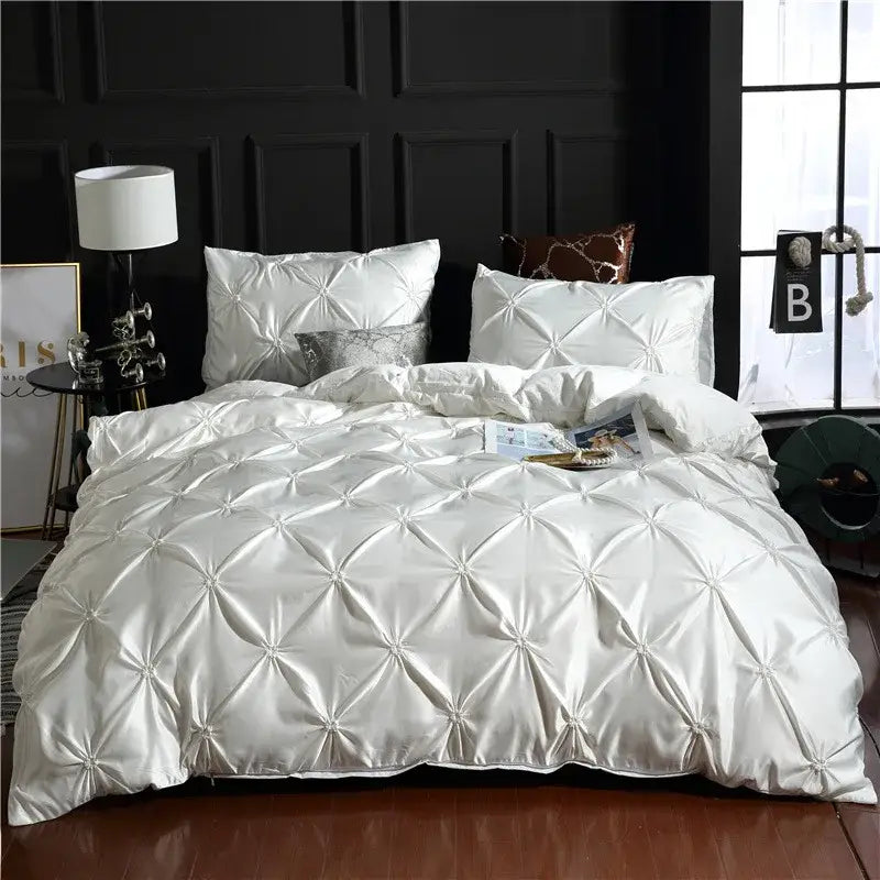 White satin quilted duvet cover with diamond tufting and pearl embellishments in decorbites chiffon flower cover set