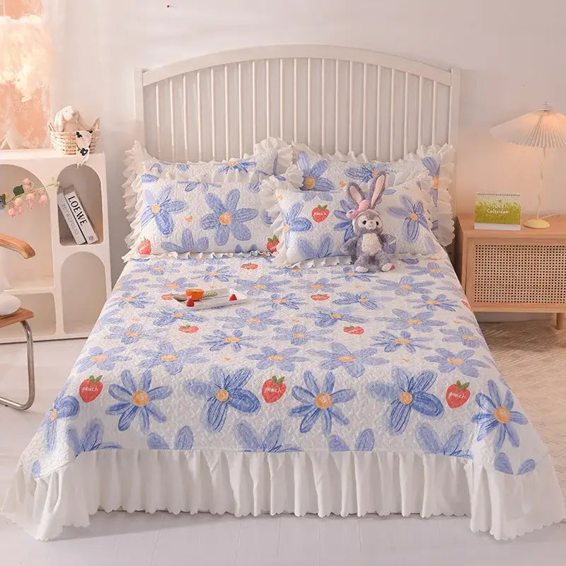 Decorbites chiffon quilted blue floral bed spread with white ruffled edges and strawberry motifs in soft cotton