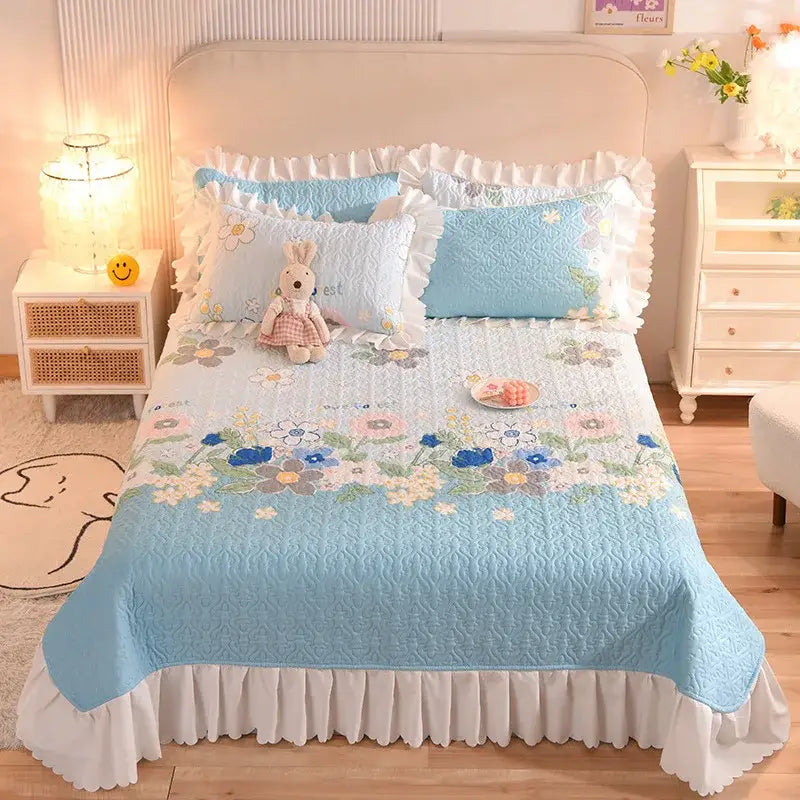 Decorbites chiffon quilted queen size cotton bedspread in light blue with embroidered floral design and white ruffled edges