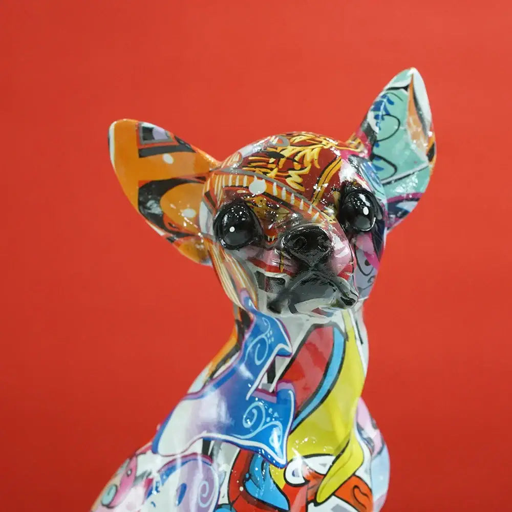 Vibrant glossy chihuahua dog resin sculpture with psychedelic pop art pattern in orange blue yellow and red by decorbites