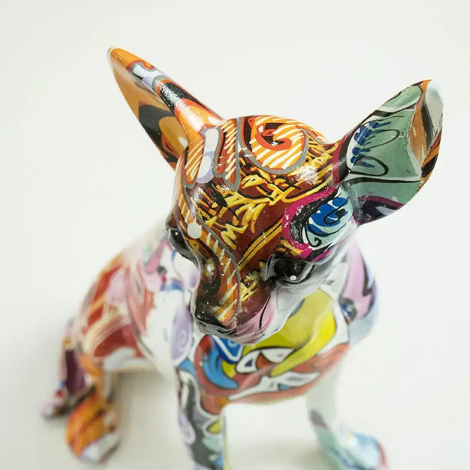 DecorBites chihuahua dog sculpture featuring vibrant orange yellow blue and pink swirls on glossy resin surface