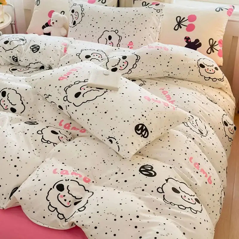 White bedding set with playful black and pink cartoon lambs polka dot print by decorbites children cartoon