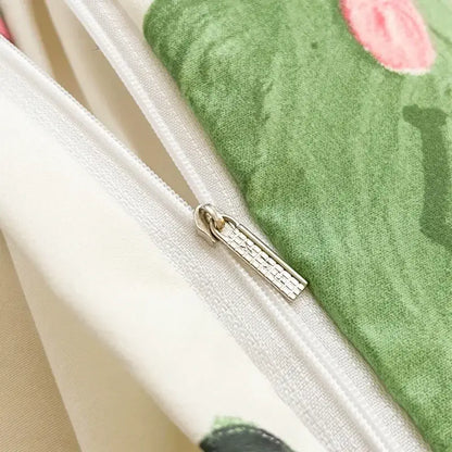 A silver-toned zipper with a textured pull tab on soft green fabric with pink floral embroidery in decorbites children cartoon bedding set