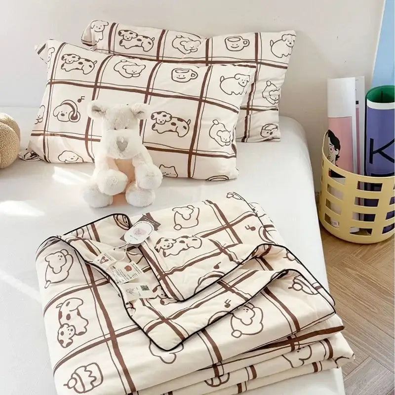 Cream-colored decorbites children cartoon cooling quilt with brown dog and coffee cup pattern in soft cotton fabric