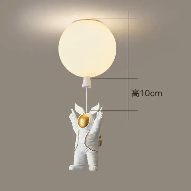 Decorbites children nordic bear astronaut ceiling chandelier with white figurine holding glowing light fixture in gold accents