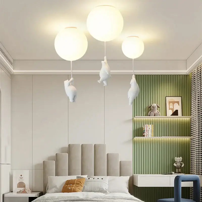 Decorbites children nordic ceiling chandelier featuring three white spherical pendant lights with bear astronaut figurines