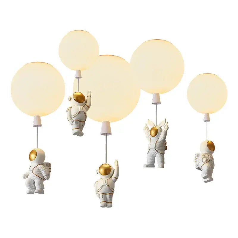 Decorbites children nordic bear astronaut ceiling chandelier with white body gold accents and glowing spherical LED bulbs
