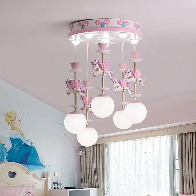 Pink and white unicorn-themed decorbites carousel led chandeliers with gold accents and frosted globe shades for living room