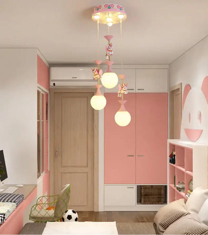 Pink ceiling-mounted decorbites carousel led chandelier with unicorn figures and spherical glass shades for living room