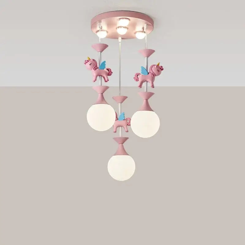 Pink unicorn-themed decorbites children’s carousel led chandelier with three white glass shades and pink decorative elements