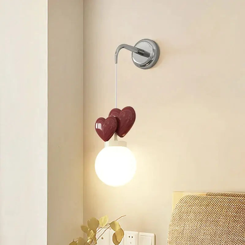 DecorBites™ children’s love wall lamp with chrome base, illuminated globe bulb, and burgundy ceramic hearts