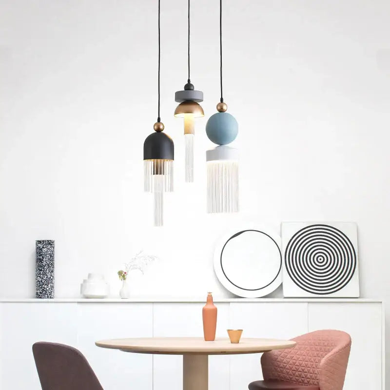 Modern pendant light with black gold blue white spherical and cylindrical glass shades for children’s room decor