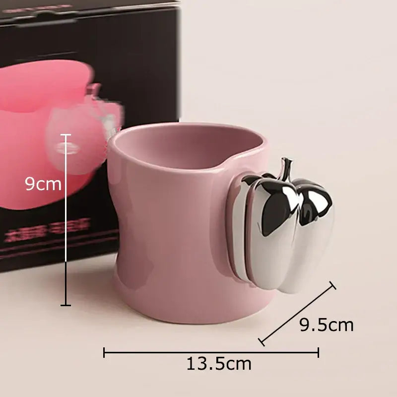 Pink porcelain decorbites chili handle cup with shiny silver and black apple-shaped handle for coffee or tea