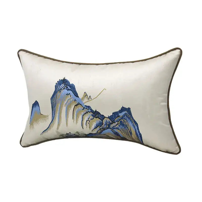 Cream-colored satin pillow cover with chinoiserie landscape embroidered design framed by dark brown piping