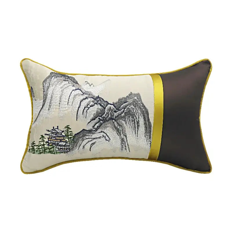 Rectangular cream pillow cover with chinoiserie landscape embroidered in gold trim and dark brown satin panel by DecorBites
