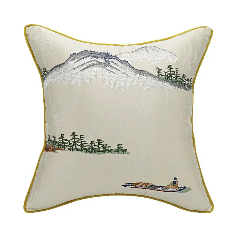 Cream-colored velvet pillow cover with chinoiserie landscape embroidered mountain scene and yellow border by decorbites