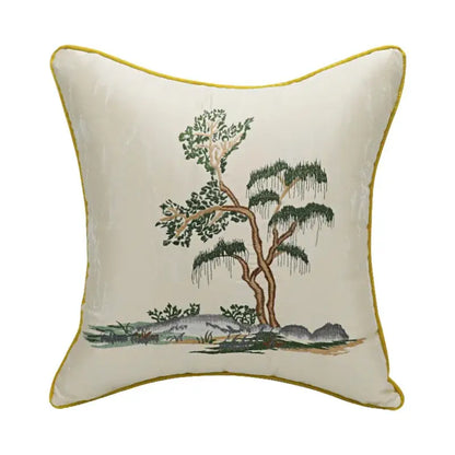 Cream-colored velvet pillow cover with chinoiserie landscape embroidered tree design and mustard-yellow border by decorbites