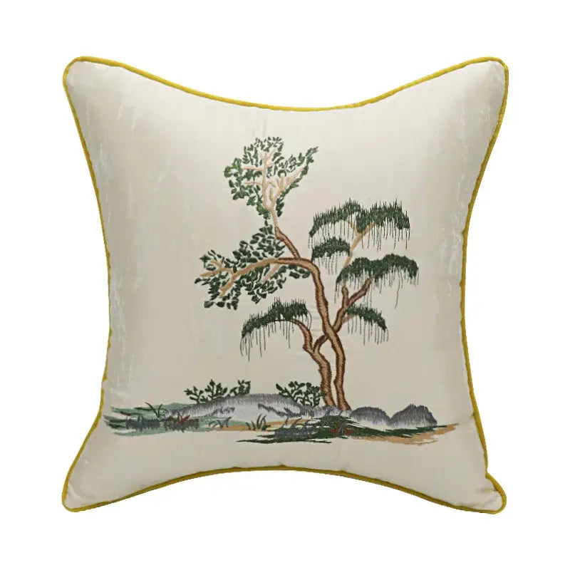 Cream-colored velvet pillow cover with chinoiserie landscape embroidered tree design and mustard-yellow border by decorbites