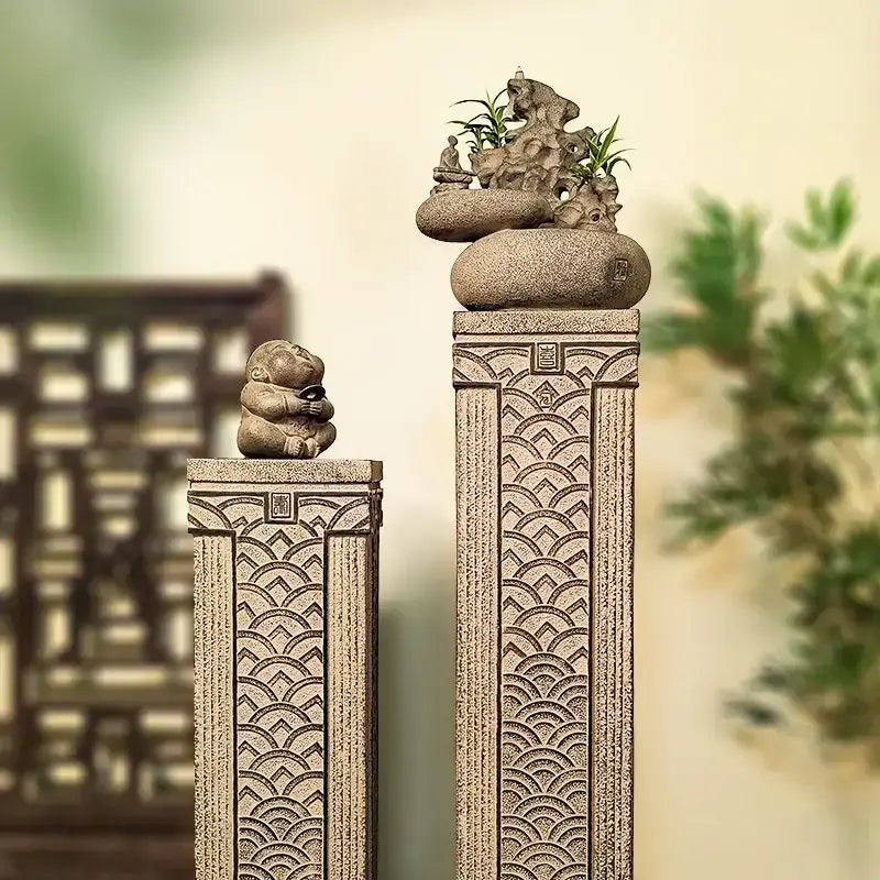 DecorBites™ stake display column with stone pillars, wave carvings, buddha figurine, and decorative rock garden greenery