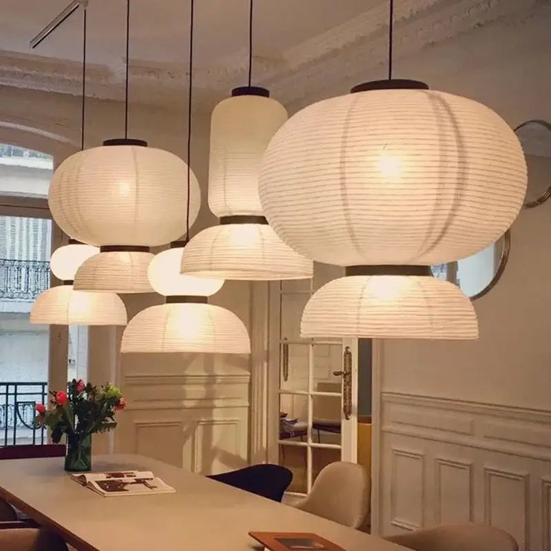 White paper lantern pendant light with black metal accents by decorbites ideal for living room and restaurant decor