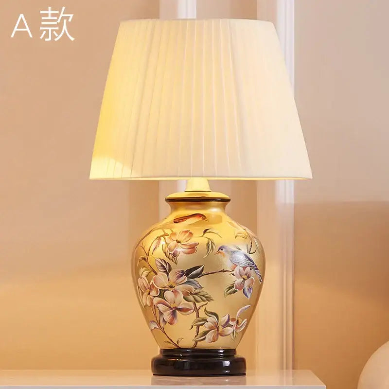 Decorbites™ chinese bird flower ceramic table lamp with golden-yellow base and cream pleated shade for bedroom use