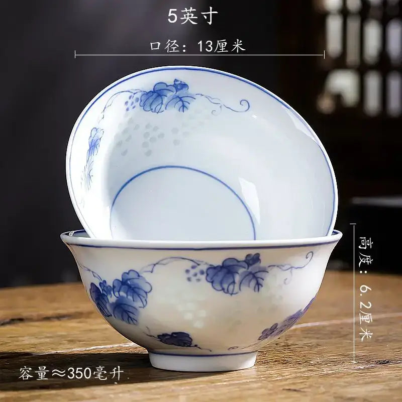 A set of two white porcelain vegetable plates and rice soup bowls with delicate blue floral patterns by decorbites