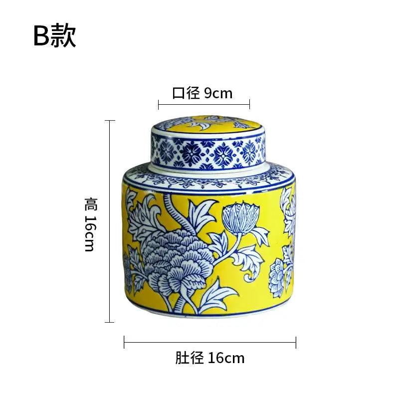 A vibrant yellow ceramic tea caddy with intricate blue floral patterns and a matching lid in decorbites chinese blue white porcelain style