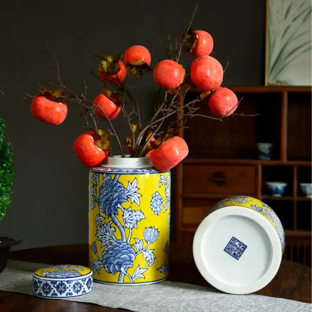 A vibrant yellow ceramic decorbites chinese blue white porcelain general’s jar with blue floral patterns and matching lid