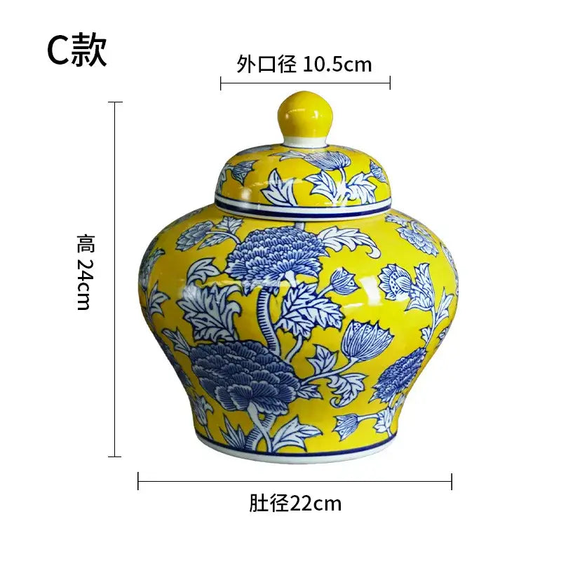 Vibrant yellow ceramic jar with blue floral patterns and lid showcasing decorbites chinese blue white porcelain craftsmanship