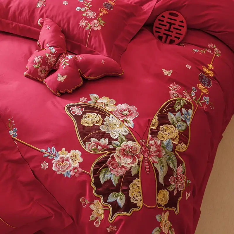Vibrant red satin bedding set with intricate gold pink yellow and green embroidery by DecorBites chinese butterfly flowers