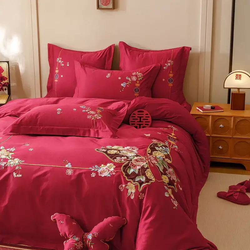 Rich crimson satin bedding set with intricate gold pink and green floral and butterfly embroidery by DecorBites Chinese butterfly flowers