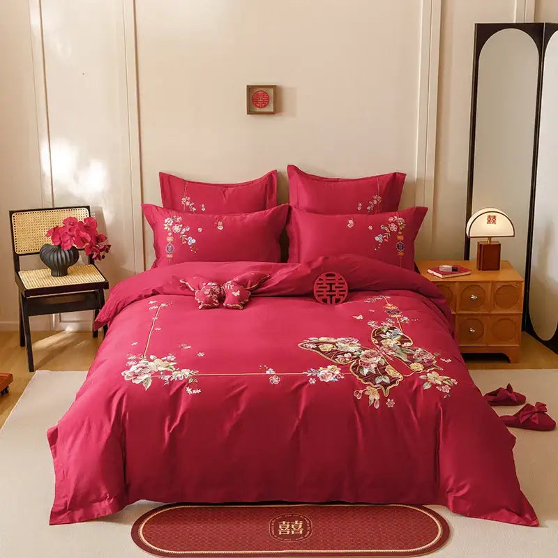 Vibrant red satin bedding set with intricate gold thread embroidery featuring decorbites chinese butterfly flowers