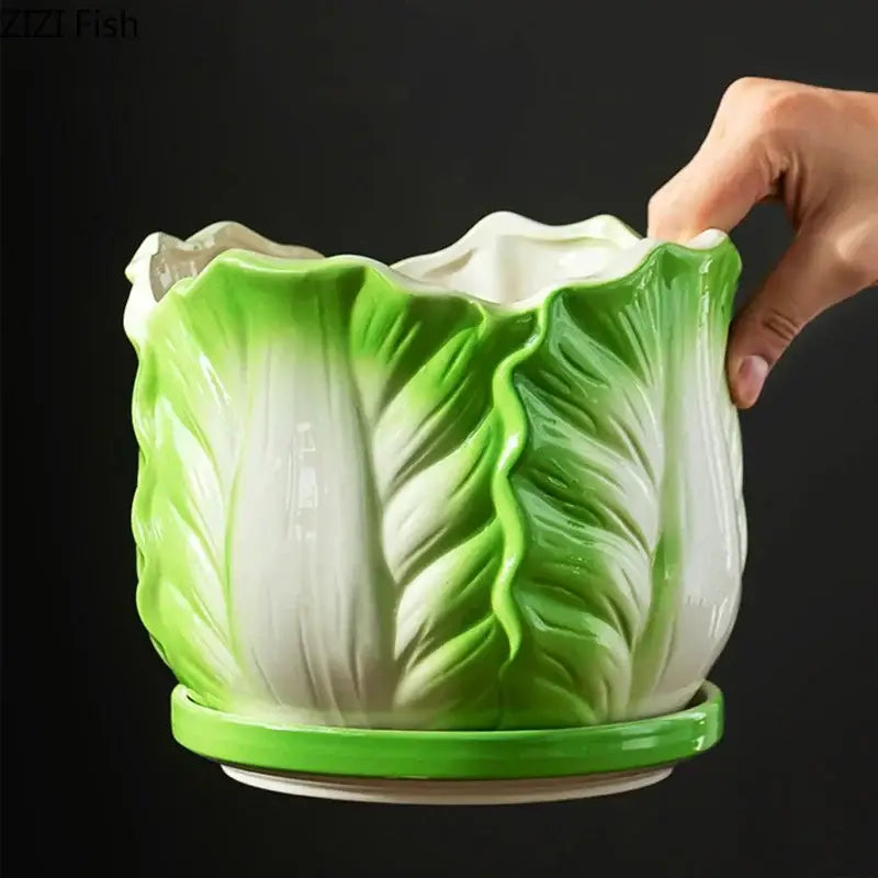A glossy ceramic vase shaped like green and white chinese cabbage with a matching saucer by decorbites chinese cabbage