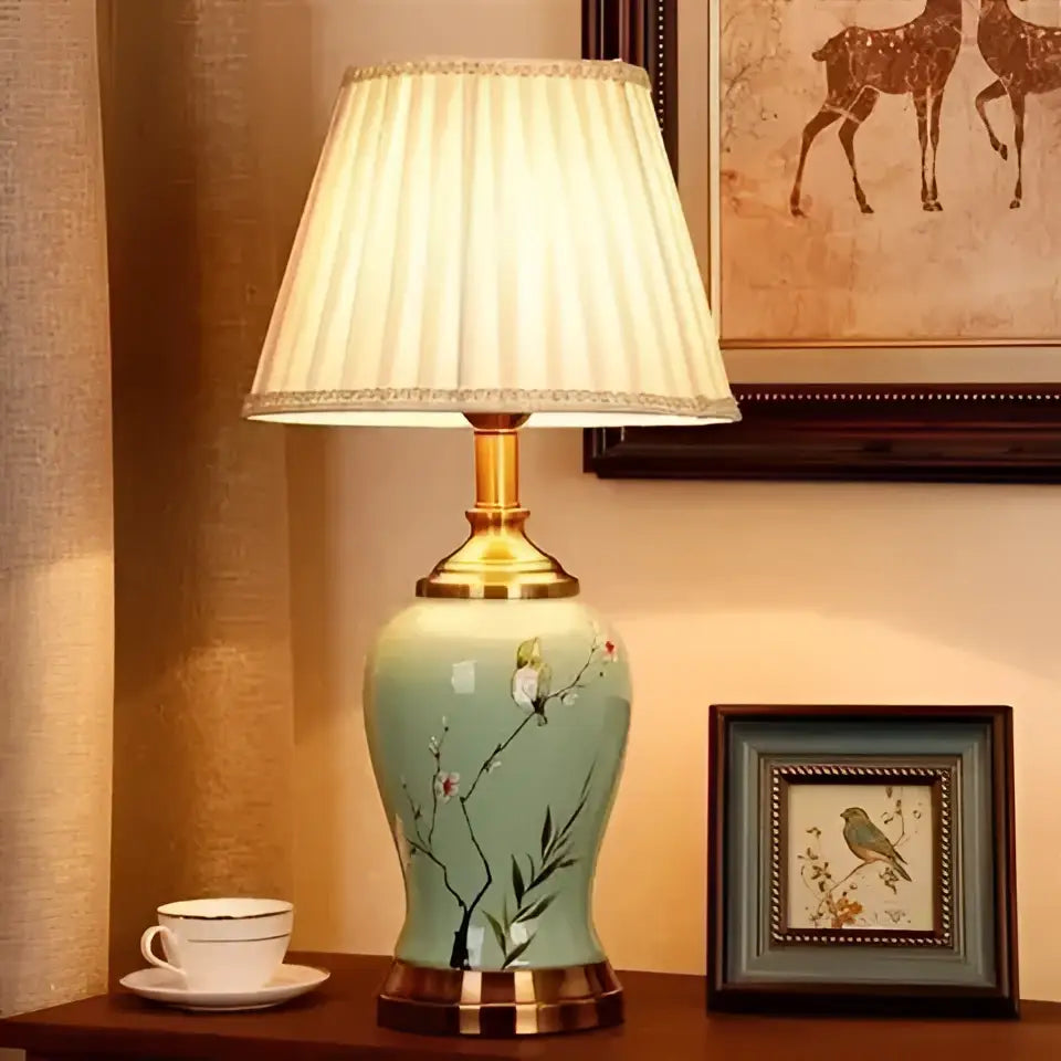 DecorBites™ ceramic table lamp with light green glazed body hand-painted with birds and blossoms for living rooms
