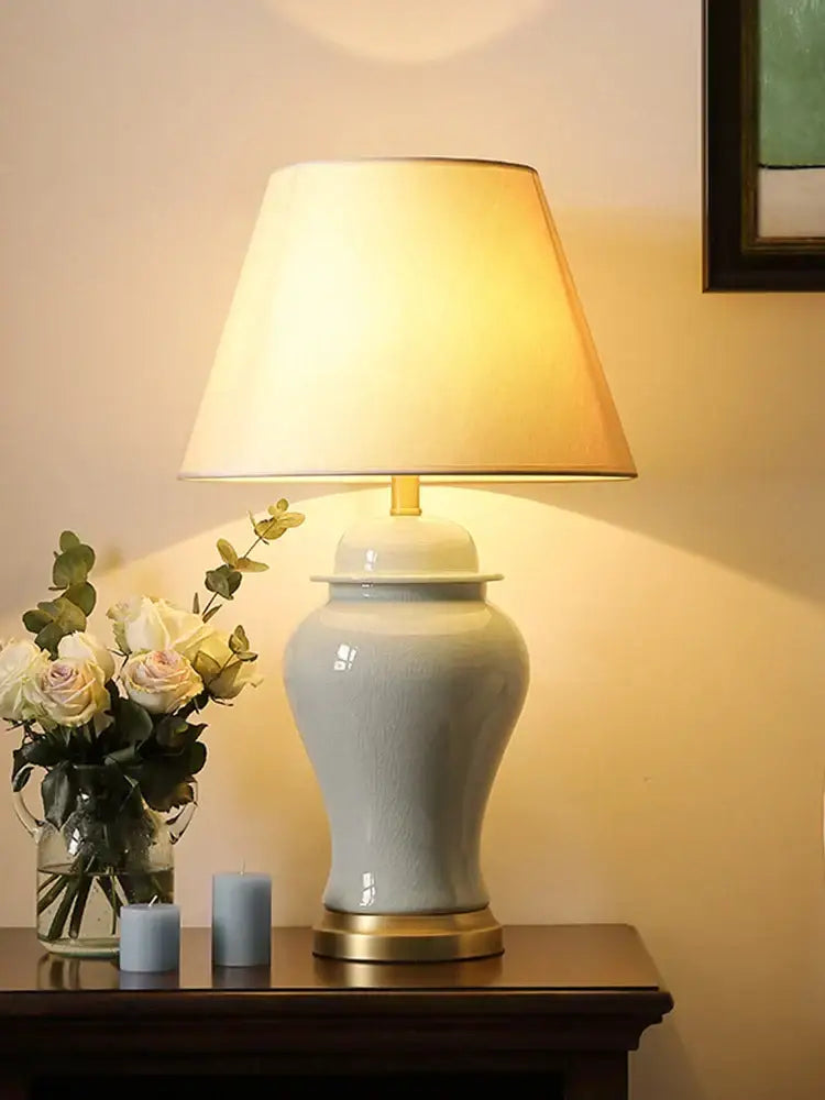 A sleek light blue ceramic table lamp with gold-toned base from DecorBites ceramic table lamps collection
