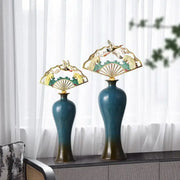 Two ornate teal and gold ceramic vases with fan-shaped finials featuring bird and wave designs for living room decorbites chinese ceramic decor
