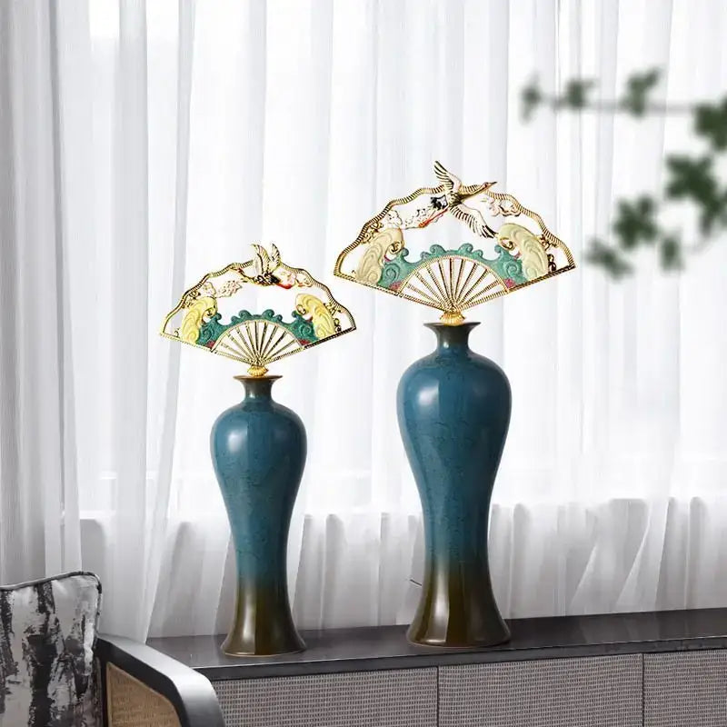 Two ornate teal and gold ceramic vases with fan-shaped finials featuring bird and wave designs for living room decorbites chinese ceramic decor