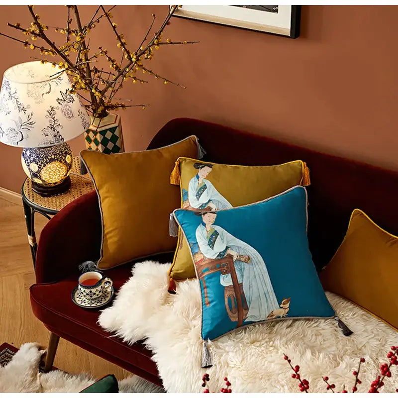 Blue cushion cover featuring an embroidered classical women print in white robe with gold tassels by DecorBites™