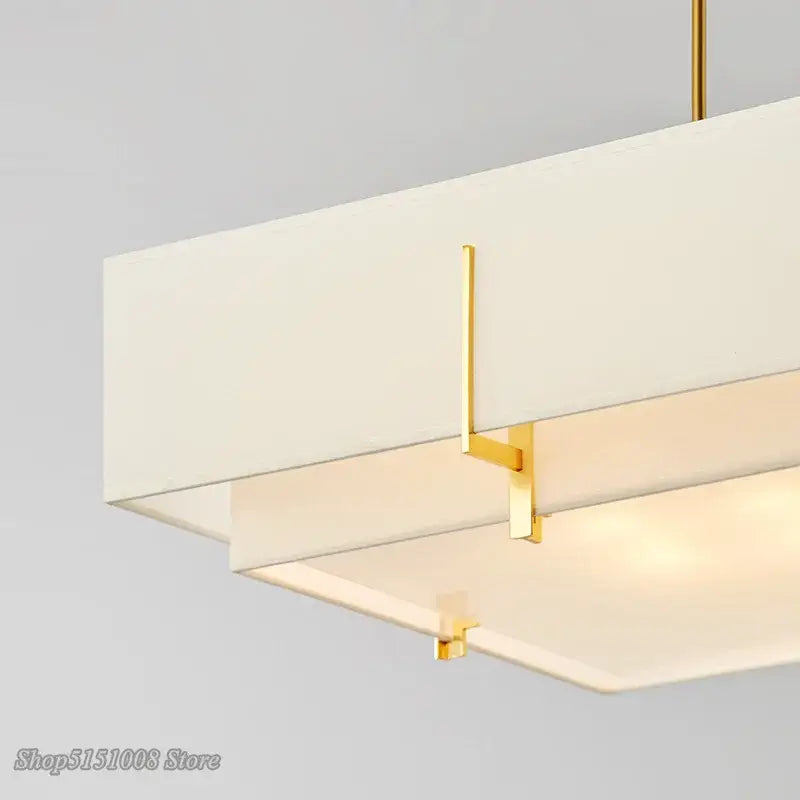 Modern minimalist living pendant lamp with matte white diffuser and polished gold metal frame for minimalist living room