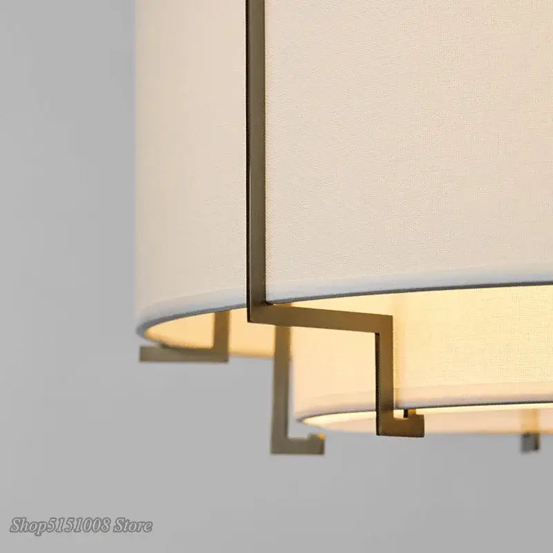 Cream-colored fabric pendant lamp with geometric brass frame for modern minimalist living room decorbites chinese cloth art
