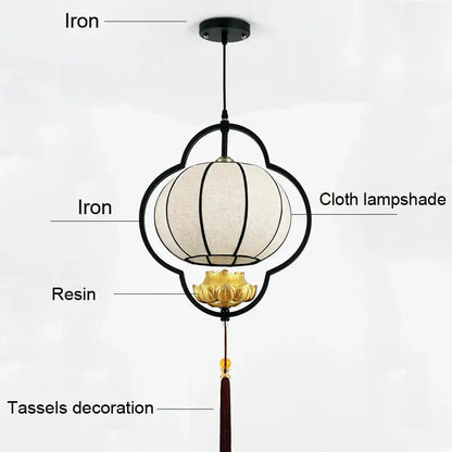 Black iron frame pendant light with cream cloth shade gold lotus base and red tassels for elegant tea house decor