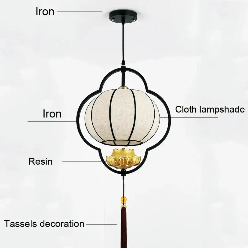 Black iron frame pendant light with cream cloth shade gold lotus base and red tassels for elegant tea house decor