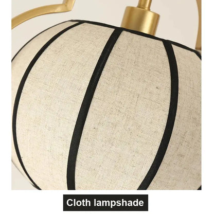 Beige linen pendant light with black stripes and gold fixture from DecorBites elegant tea house chandelier collection