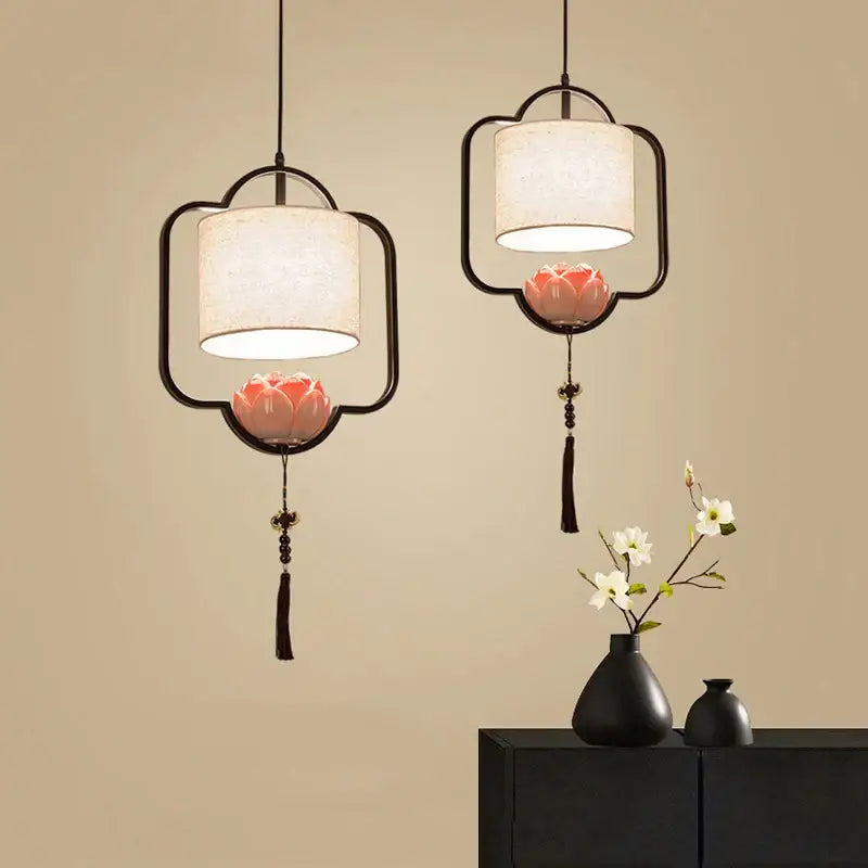 DecorBites cloth chandelier with black frames, off-white fabric shades, and pink lotus blossoms for dining room use