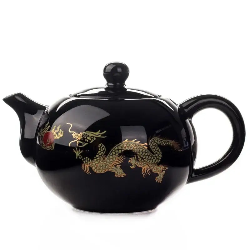 Black ceramic red tea pot with glossy finish and intricate golden dragon design in decorbites™ kung fu teaware set