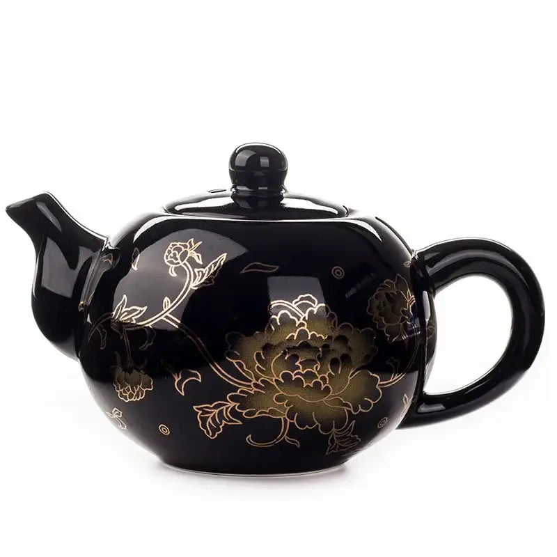 Black ceramic tea pot with gold floral patterns and glossy finish from DecorBites™ dragon ceramic red tea set
