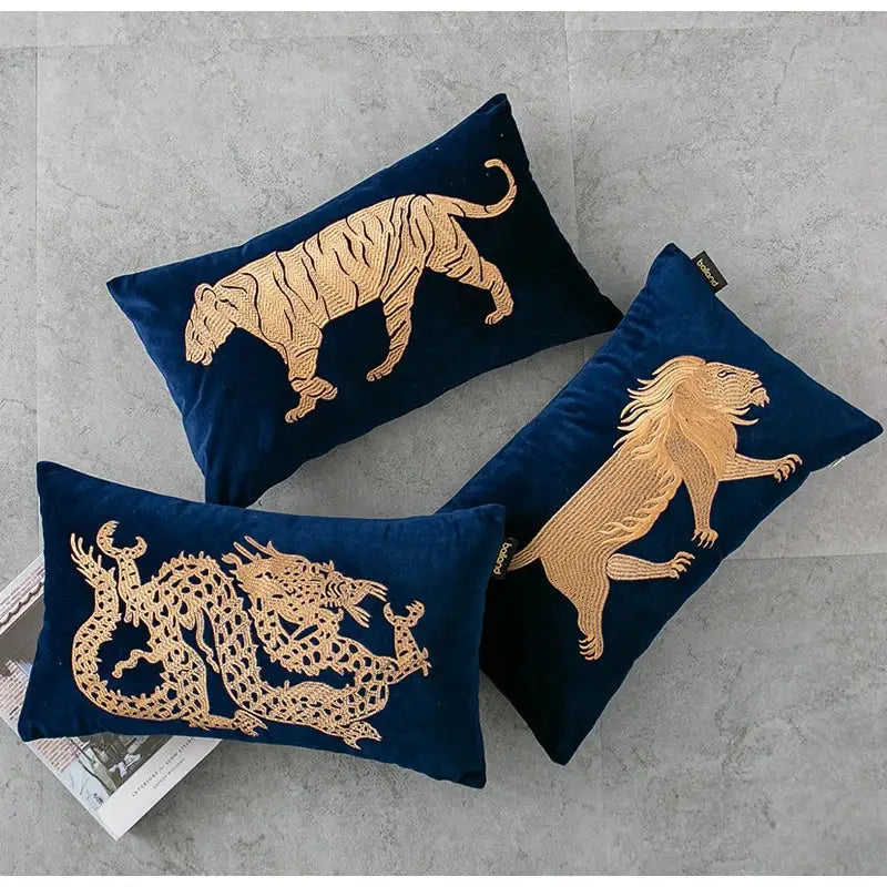 Deep blue velvet pillow cover with intricate gold dragon embroidery lumbar design featuring tiger and lion motifs