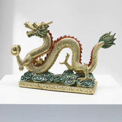 Golden chinese dragon resin sculpture with red and green accents detailed scales and ornate base by decorbites chinese dragon