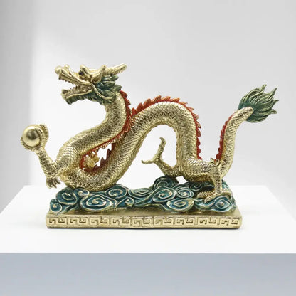 DecorBites chinese dragon resin sculpture featuring detailed golden scales with red and green accents on a decorative base